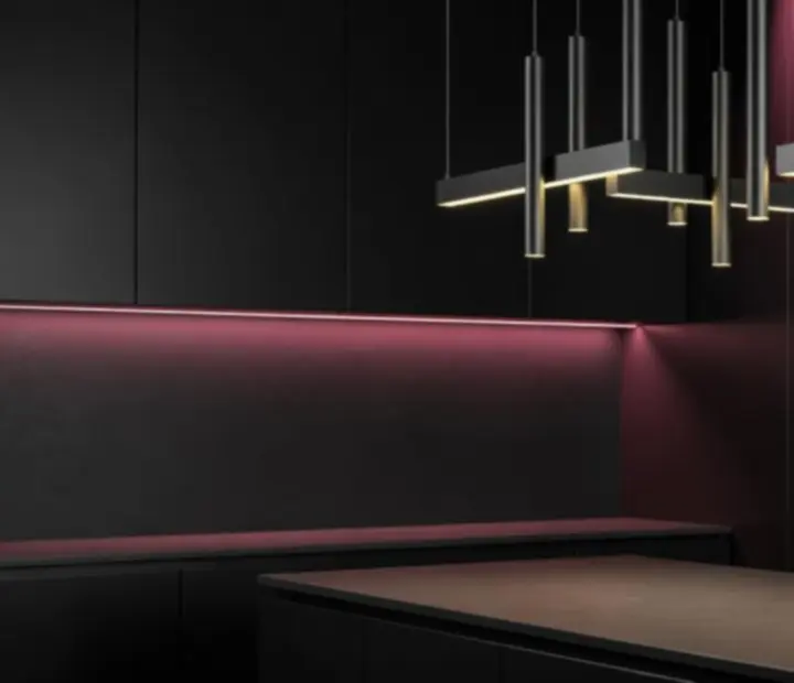 Interior lighting detail showing matte-black finishes with pink and yellow highlights.