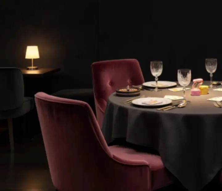 Private themed dining corner with velvet seating and soft lighting.